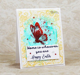 Handmade card featuring the delicate all-over lace pattern filling an A2 background, in gold behind a butterfly, stamped with 'Home is wherever you are, Happy Easter'.
