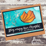 Turquoise and white inked panel on a rust kraft card, one orange butterfly, sentiment 'strong, amazing, brave, & beautiful, that's what you are...'.