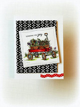 Small card with the flower-filled red wagon matted on black-and-white patterned paper.