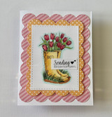 Card with a rain boot full of red tulips on a scalloped pink frame and 'Sending brighter days.'