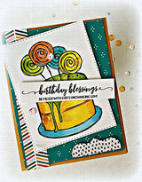 Lollipops and a cake on a green and striped layered card, captioned 'birthday blessings be filled with God's unchanging love.'
