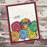 A cluster of colorful swirled lollipops on a confetti card, captioned 'sweet birthday wishes.'