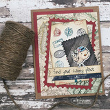 Vintage-style card with a stamped girl and birds, layered papers and twine, 'find your happy place.'