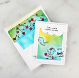 Bright card with birds on a branch inside an aqua-and-yellow frame, 'just a card to brighten your day.'