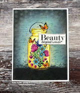 Glowing yellow jar of flowers on a dark distressed background, 'Beauty beyond words.'
