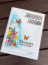 Jar of colorful flowers with a butterfly on a blue-washed card, 'Beauty beyond words.'
