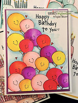 Cluster of colorful smiley balloons, 'Happy Birthday to you.'