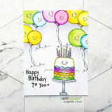 Smiley balloons and a rainbow cake, 'Happy Birthday to you.'