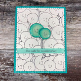 Cluster of pale smiley balloons with two teal ones, 'This calls for a celebration!'