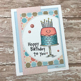Grinning cake on a dotted circle, 'Happy Birthday to you.'