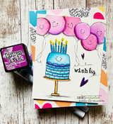 Smiley pink balloons and a teal cake, 'wish big.'