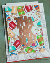 Oversized bold block-letter greeting words stamped in red rubber and colored on a handmade card reading "Birthday."