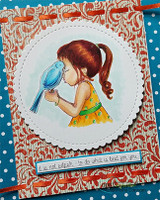 Card with the girl in a yellow dress holding a blue bird on a red-orange floral panel.