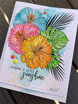 Handmade card made with Unity Stamp Co’s Time to Refresh red rubber stamp set — tropical hibiscus flowers and monstera and palm leaves — stamped and colored, with the sentiment “Sending a little sunshine”.