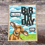 Cow peeking at a bold 'BIRTHDAY BOY' block sentiment over a cloudy sky, 'hi there'.