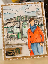 Card with the colored cafe storefront and a woman in an orange sweater standing out front.