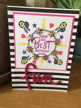 Black-striped card with a small icon wreath and a red 'fun' die, 'HAVE the BEST BIRTHDAY ever!'