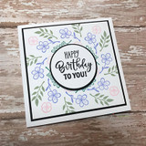 Soft floral card with a delicate wreath, 'Happy Birthday TO YOU!'