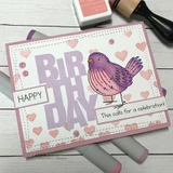 Card with a purple bird over hearts and a bold 'BIRTHDAY' and 'This calls for a celebration!'