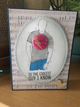 Card with Roger holding a red heart over a soft oval and 'to the coolest guy I know.'