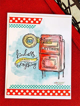 Card with a red mailbox and postmarks, 'kindness changes everything.'