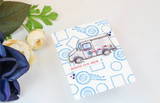 Soft card with a mail truck and postmarks, '#lettersforhenry.'