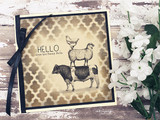 Sepia quatrefoil card with the stack and 'HELLO, from the funny farm.'