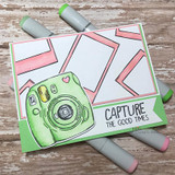 Clean card with a green instant camera and Polaroid frames, stamped 'Capture the good times.'