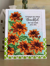 Orange and rust dahlias filling a card corner over a green pattern, thankful sentiment.