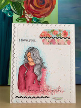 Card with the girl in a pink top on a stitched panel, 'I love you.' and 'beautiful girl' sentiments with floral trim.