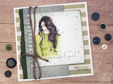 Olive-toned card with the girl in a green sweater on a striped panel with a twine accent.