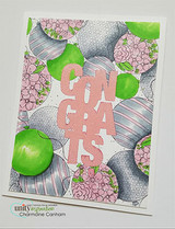 Card with the balloon border background in greens and pinks framing a die-cut 'Congrats'.