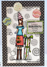 Sample card: Maggie in a teal top and red apron with a green gift on black polka dots with chevron circles and the birthday sentiment
