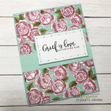 Soft green card on rose-patterned paper with a sentiment panel stamped 'Grief is love with no place to go.'