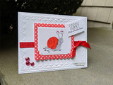 Card with a snail on a green grassy slope and 'SORRY I'm a little late.'