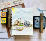 Card with a snail scene beside Distress inks and stencil tools, 'stencil for art.'
