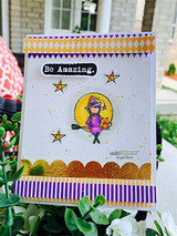 Witch girl under a moon with a black cat, 'Be Amazing,' purple and gold card.