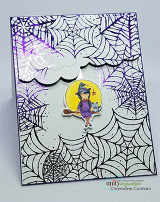 Purple-edged web card with a witch on her broom in a cloud frame