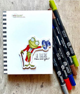 Lisa Glanz's dapper top-hatted toad with cane and monocle saying 'Hi there, how are you?', a whimsical red rubber stamp shown on a card.