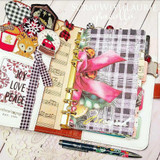 Junk-journal spread using Rustic Winter Wishes papers with plaid, music print and a pink bow