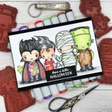 Wide card with four colored monsters, a vampire, a mummy and Frank among them. Lettered 'have a killer HALLOWEEN,' shown with markers and red rubber stamps.