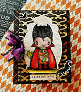 Halloween card with the little vampire on an argyle-and-cheetah panel and 'i like you. a lot.'