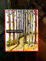 Red-matted card with a sunlit path through the woods and 'YOU ARE NOT ALONE' on a black banner.