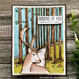 Card with a deer among the stamped trees, 'THINKING OF YOU please know I care.'