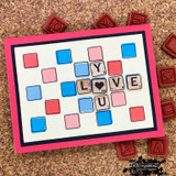 Card spelling 'LOVE YOU' with colorful letter tiles in a scrabble-style grid.