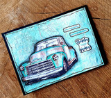 Mixed-media card of a weathered blue truck on a distressed teal background.