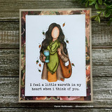 Fall-papered card with the green-scarf girl and 'I feel a little warmth in my heart when I think of you'