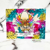 Wide-eyed turkey on a bright rainbow-leaf card, 'HAPPY THANKSGIVING (eat the ham)'.