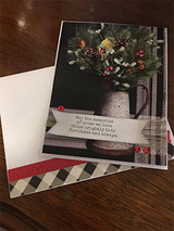 Card with a winter floral arrangement, 'May the memories of those we love shine.'
