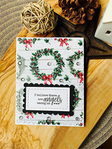 Card with a holiday wreath, 'I believe there are angels among us.'